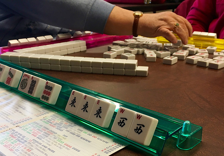 Learning to Play Mahjong